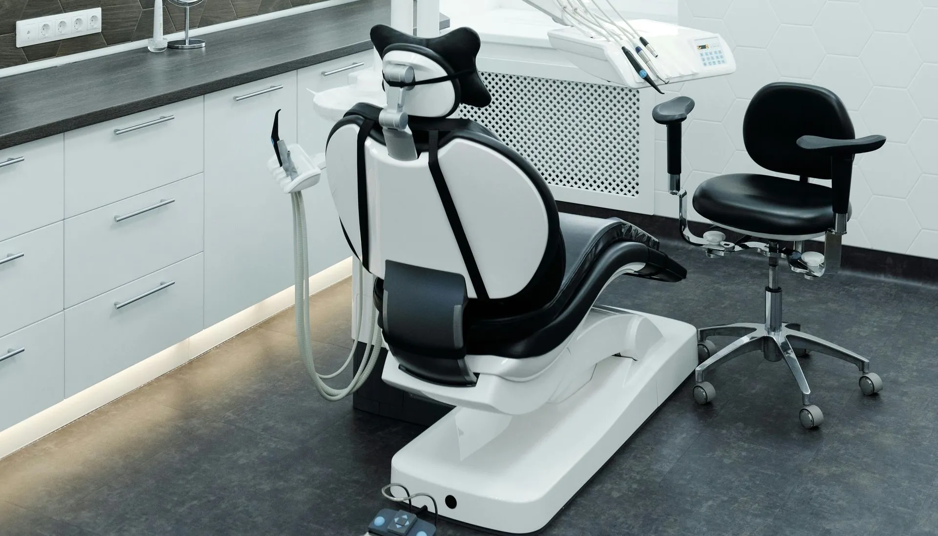 Modern dental treatment room with chair and equipment